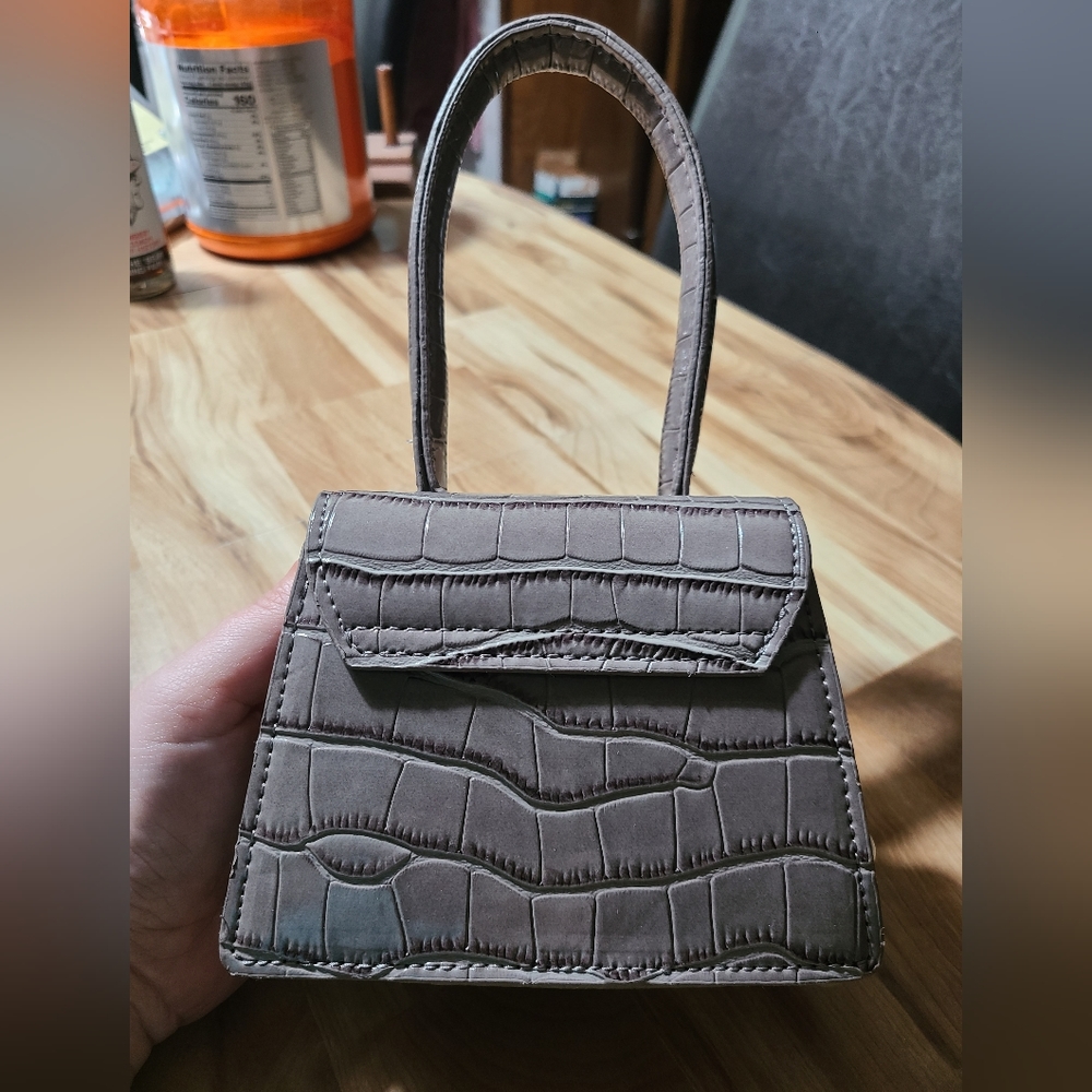 Small gray croc top handle. Removable pearl strap. Removable crossbody strap.
